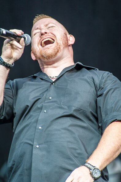 Master Sgt. Mike Brown sings “At Last” by Etta James during the AMC Icon vocal competition at the Riverfront Park Lilac Bowl in Spokane, Wash., June 21, 2014. The AMC Icon program is loosely based around the hit TV program, American Idol, and allows local contestants to compete for $1,000 in cash prizes. The top active duty Air Force vocalist will then compete for $2,000 in cash prizes at the command level. Brown earned first place in Fairchild Air Force Base’s competition winning $500 and a ticket to Scott Air Force Base, Ill., for the Command Finals. He is the 368th Recruiting Squadron flight chief in Spokane. (U.S. Air Force photo by Staff Sgt. Benjamin W. Stratton/Released)
