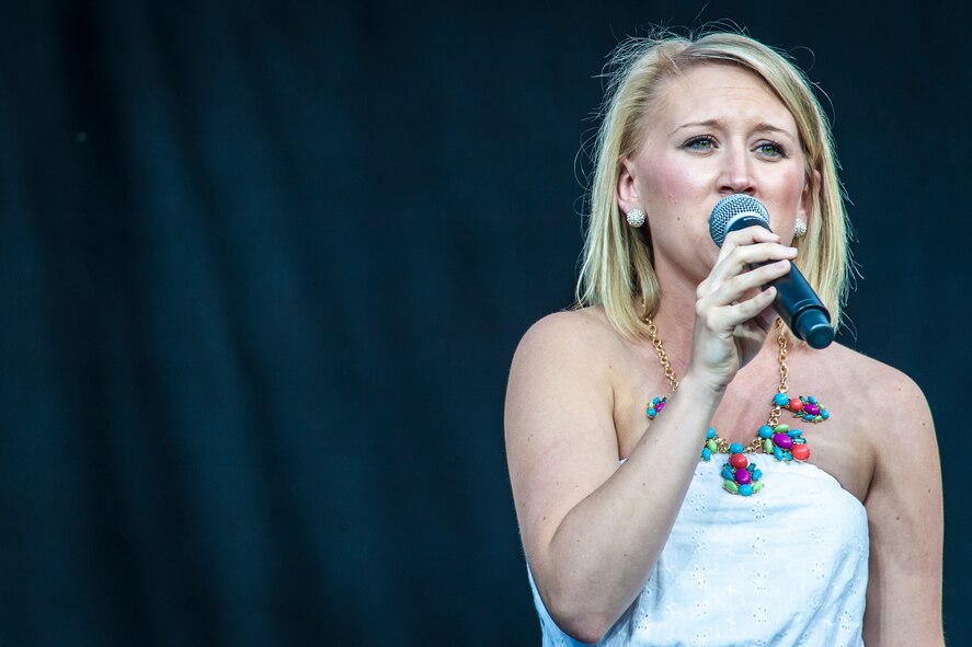 Morgan Teston sings “Traveling Soldier” by the Dixie Chicks during the AMC Icon vocal competition at the Riverfront Park Lilac Bowl in Spokane, Wash., June 21, 2014. The AMC Icon program is loosely based around the hit TV program, American Idol, and allows local contestants to compete for $1,000 in cash prizes. The top active duty Air Force vocalist will then compete for $2,000 in cash prizes at the command level. Teston earned second place in Fairchild Air Force Base’s competition winning $300 and is the wife of Senior Airman Riley Teston, a 92nd Civil Engineer Squadron water and fuels systems maintenance technician. (U.S. Air Force photo by Staff Sgt. Benjamin W. Stratton/Released)