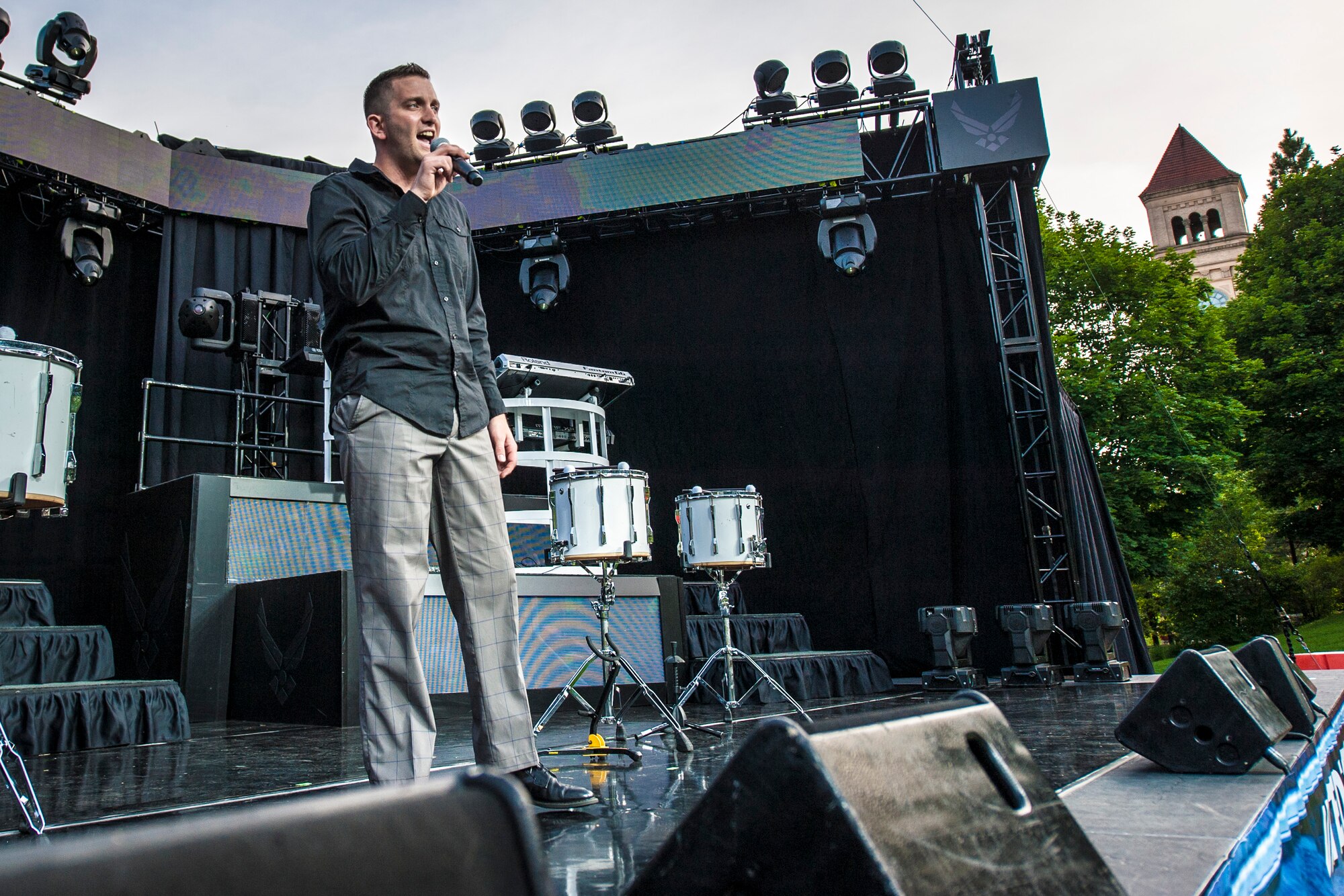 Senior Airman Kyle Zachery sings “All of me” by John Legend during the AMC Icon vocal competition at the Riverfront Park Lilac Bowl in Spokane, Wash., June 21, 2014. The AMC Icon program is loosely based around the hit TV program, American Idol, and allows local contestants to compete for $1,000 in cash prizes. The top active duty Air Force vocalist will then compete for $2,000 in cash prizes at the command level. Zachery earned third place in Fairchild Air Force Base’s competition winning $200 and is a 92nd Aircraft Maintenance Squadron crew chief. (U.S. Air Force photo by Staff Sgt. Benjamin W. Stratton/Released)