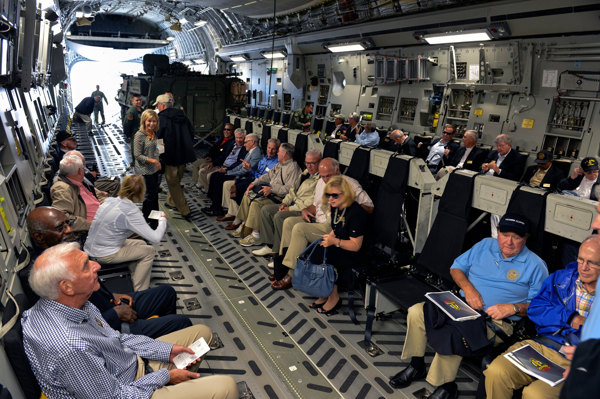 Civilian Aides to the Secretary of the U.S. Army board a C-17 Globemaster III loaded with a Stryker combat vehicle June 23, 2014, to fly from McChord Field to Gray Army Airfield during the 2014 National CASA Conference at Joint Base Lewis-McChord, Wash. The hopes were that the CASA leaders completed their annual training, shared close contact with Soldiers, Airmen, civilians and spouses, and gained a greater understanding of JBLM. (U.S. Air Force photo/Staff Sgt. Russ Jackson)