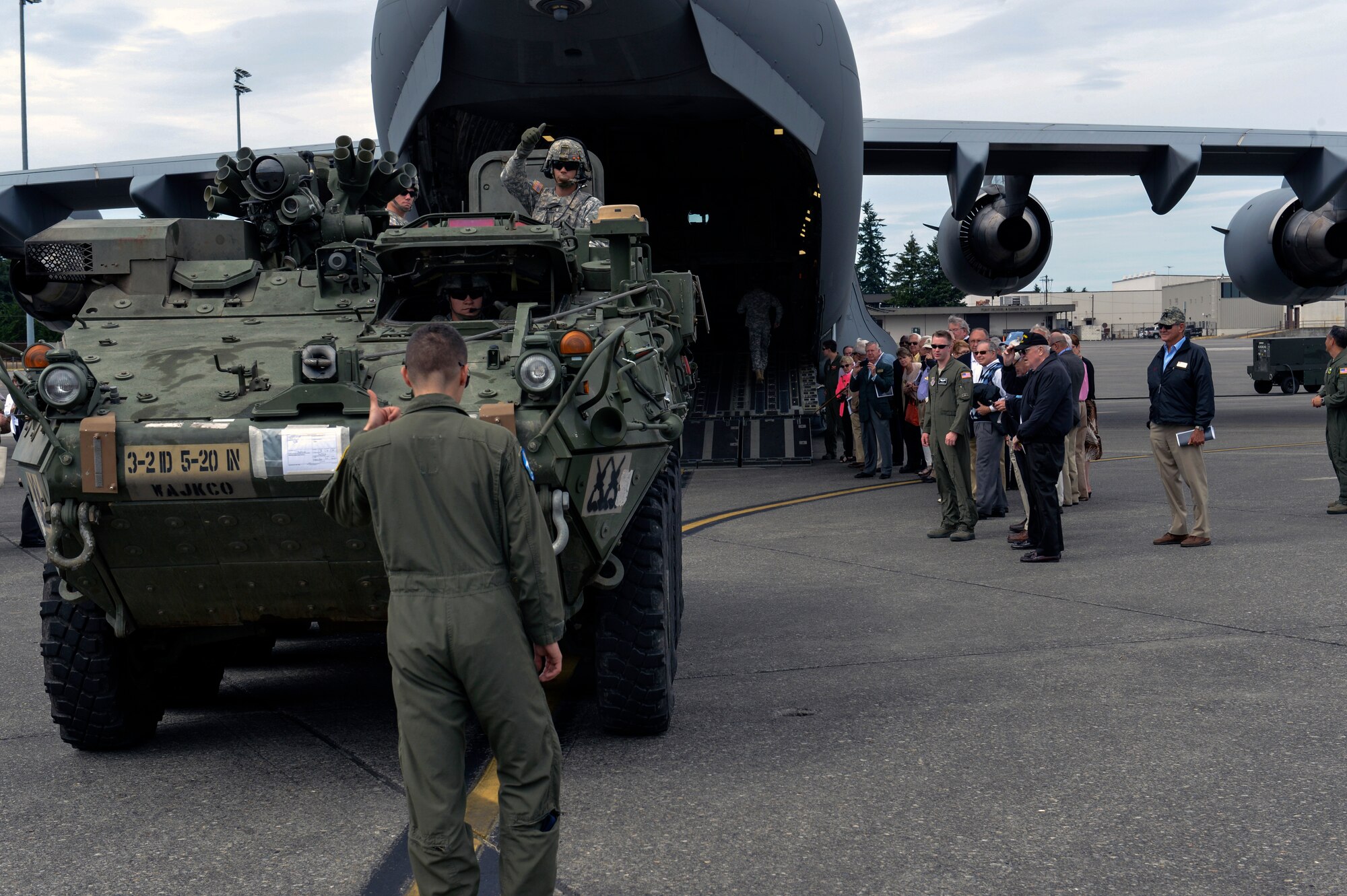 Soldiers and Airmen work together to load an Army Stryker combat vehicle onto an Air Force C-17 Globemaster III June 23, 2014, during the 2014 National Civilian Aides to the Secretary of the U.S. Army Conference at Joint Base Lewis-McChord, Wash. I Corps and JBLM used this event to showcase Army and Air Force capabilities here, to provide insight to the Power Projection capabilities and understanding for ongoing operational missions in the Pacific. (U.S. Air Force photo/Staff Sgt. Russ Jackson)