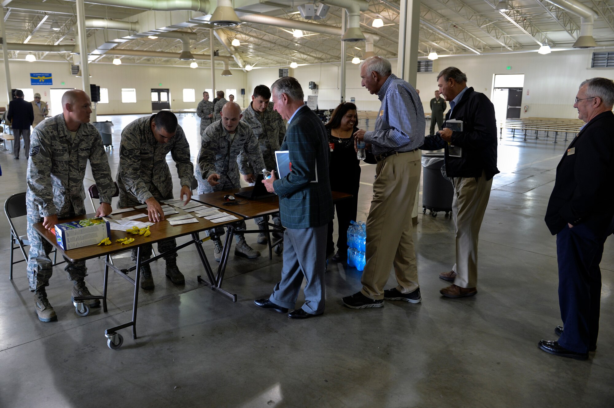 Airmen from the 62nd Aerial Port Squadron check in Civilian Aides to the Secretary of the U.S. Army June 23, 2014, for their C-17 Globemaster III flight from McChord Field to Gray Army Airfield during the 2014 National CASA Conference at Joint Base Lewis-McChord, Wash. I Corps hosted the conference to provide its members training and understanding of how JBLM has fully integrated to improve Army and Air Force capabilities. (U.S. Air Force photo/Staff Sgt. Russ Jackson)