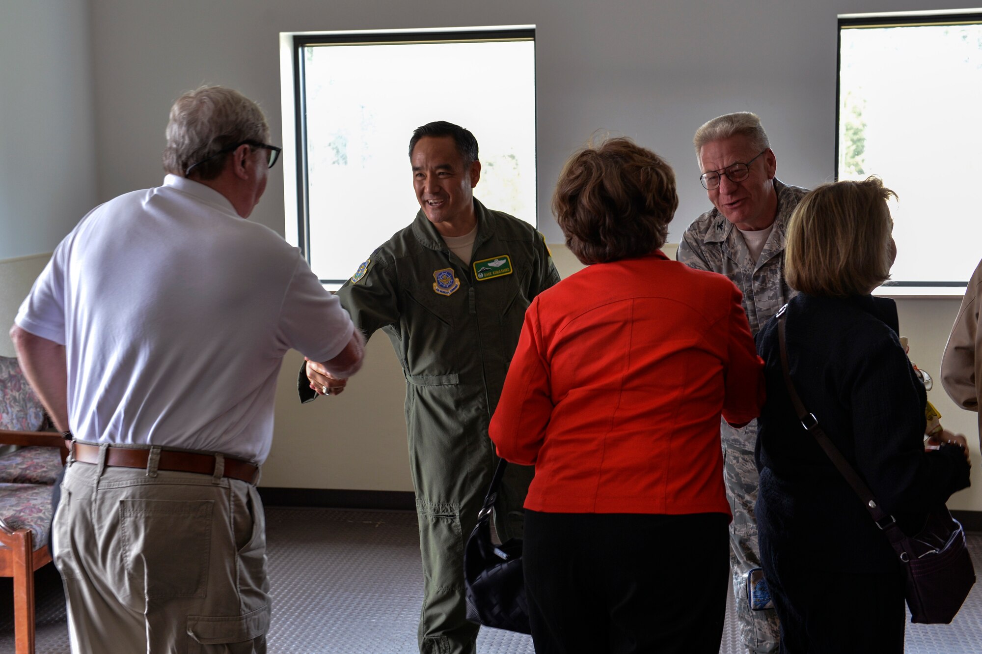 Col. David Kumashiro (center), 62nd Airlift Wing commander and Col. Bruce Bowers (right), 446th Airlift Wing commander greet Civilian Aides to the Secretary of the U.S. Army June 23, 2014, during the 2014 National CASA Conference at Joint Base Lewis-McChord, Wash. The Secretary of the Army selected JBLM to host the conference from June 22-26. (U.S. Air Force photo/Staff Sgt. Russ Jackson)