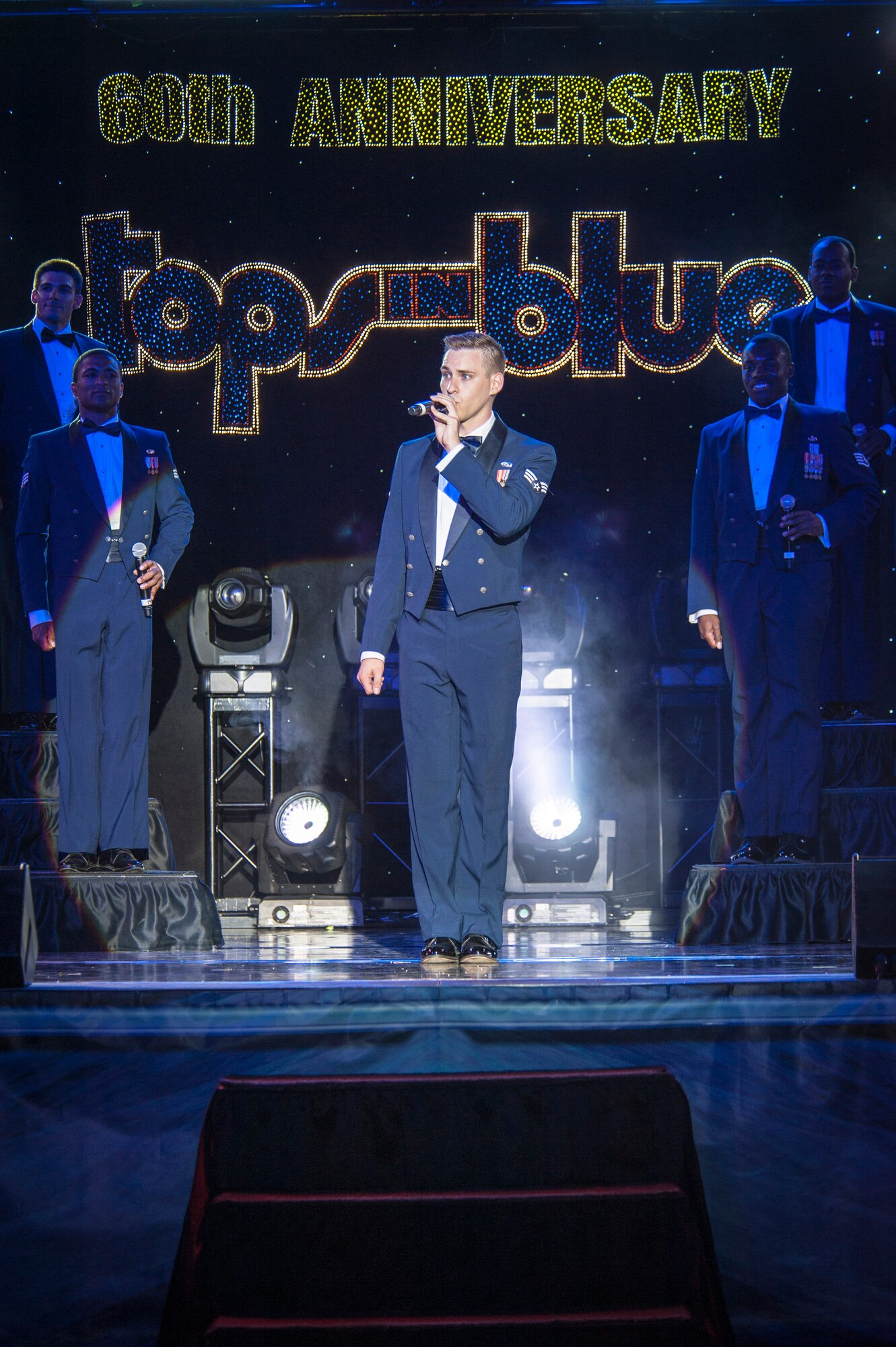 Senior Airman Jeremiah Barnes performs for the Spokane community and Team Fairchild during the Tops In Blue show at the Riverfront Park Lilac Bowl in Spokane, Wash., June 21, 2014, while on their 60th anniversary tour with performances ranging from classic rock to today’s Top 40 hits. Tops In Blue is the Air Force’s premier entertainment showcase team and composed of 35 to 40 of the most talented vocalists, musicians, dancers, and technicians anywhere. Their primary purpose is to perform for military personnel and their families throughout the world. Barnes is a vocalist and a 56th Communications Squadron cyber systems operations journeyman from Luke Air Force Base, Ariz., and a Nashville, Tenn., native. (U.S. Air Force photo by Staff Sgt. Benjamin W. Stratton/Released)