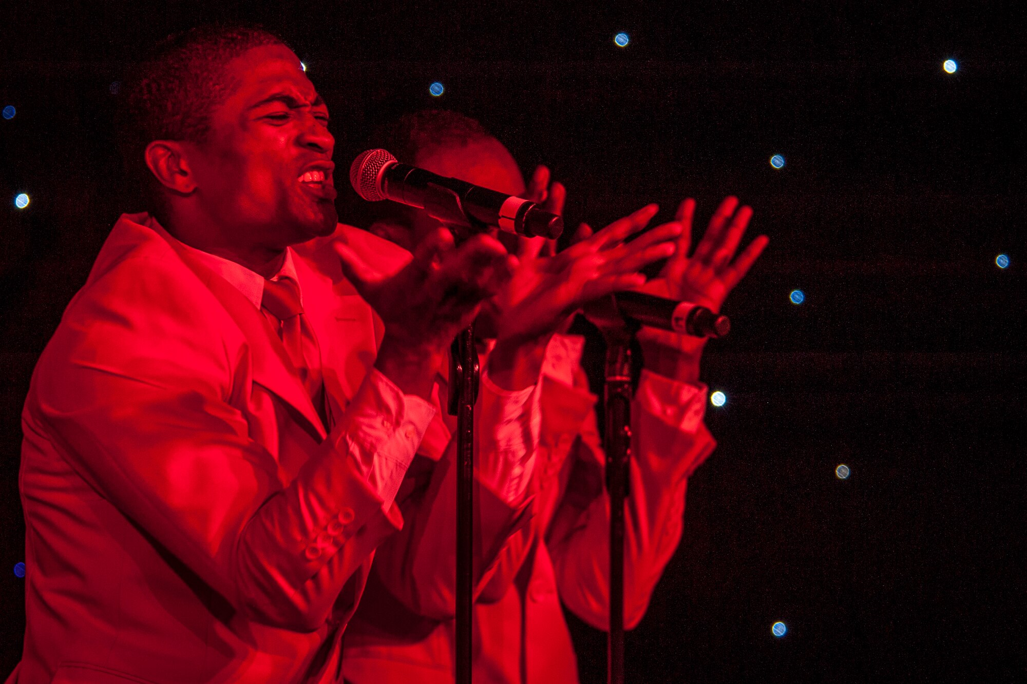 Senior Airman Charles Cooper performs for the Spokane community and Team Fairchild during the Tops In Blue show at the Riverfront Park Lilac Bowl in Spokane, Wash., June 21, 2014, while on their 60th anniversary tour with performances ranging from classic rock to today’s Top 40 hits. Tops In Blue is the Air Force’s premier entertainment showcase team and composed of 35 to 40 of the most talented vocalists, musicians, dancers, and technicians anywhere. Their primary purpose is to perform for military personnel and their families throughout the world. Cooper is a vocalist and a 509th Logistics Readiness Squadron vehicle operations journeyman from Whiteman Air Force Base, Mo., and a St. Louis, Mo., native. (U.S. Air Force photo by Staff Sgt. Benjamin W. Stratton/Released)