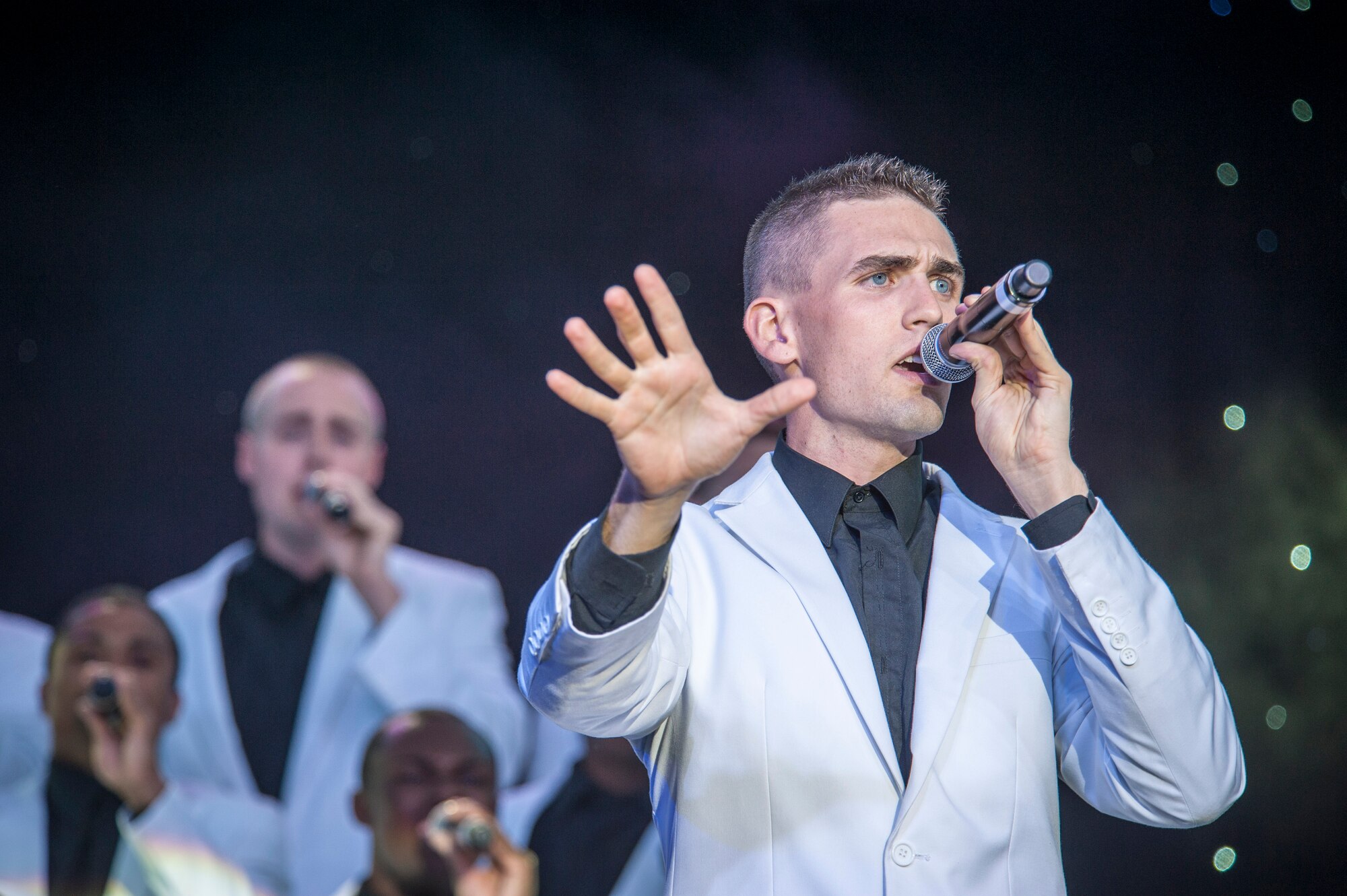 Airman 1st Class Kyle McCarty performs for the Spokane community and Team Fairchild during the Tops In Blue show at the Riverfront Park Lilac Bowl in Spokane, Wash., June 21, 2014, while on their 60th anniversary tour with performances ranging from classic rock to today’s Top 40 hits. Tops In Blue is the Air Force’s premier entertainment showcase team and composed of 35 to 40 of the most talented vocalists, musicians, dancers, and technicians anywhere. Their primary purpose is to perform for military personnel and their families throughout the world. McCarty is a vocalist and a 15th Aircraft Maintenance Squadron aircraft maintenance journeyman from Joint Base Pearl Harbor-Hickam, Hawaii, and a Berlin, N.J., native. (U.S. Air Force photo by Staff Sgt. Benjamin W. Stratton/Released)