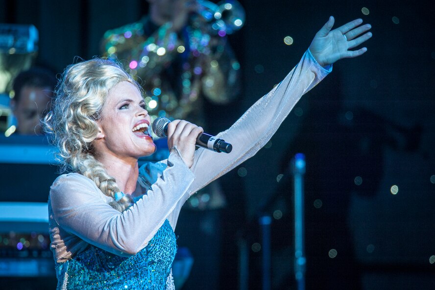 1st Lt. Amanda Bills performs for the Spokane community and Team Fairchild during the Tops In Blue show at the Riverfront Park Lilac Bowl in Spokane, Wash., June 21, 2014, while on their 60th anniversary tour with performances ranging from classic rock to today’s Top 40 hits. Tops In Blue is the Air Force’s premier entertainment showcase team and composed of 35 to 40 of the most talented vocalists, musicians, dancers, and technicians anywhere. Their primary purpose is to perform for military personnel and their families throughout the world. Bills is a vocalist and a 707th Force Support Squadron personnel officer from Fort George G. Meade, Md., and a Murfressboro, Tenn., native. (U.S. Air Force photo by Staff Sgt. Benjamin W. Stratton/Released)