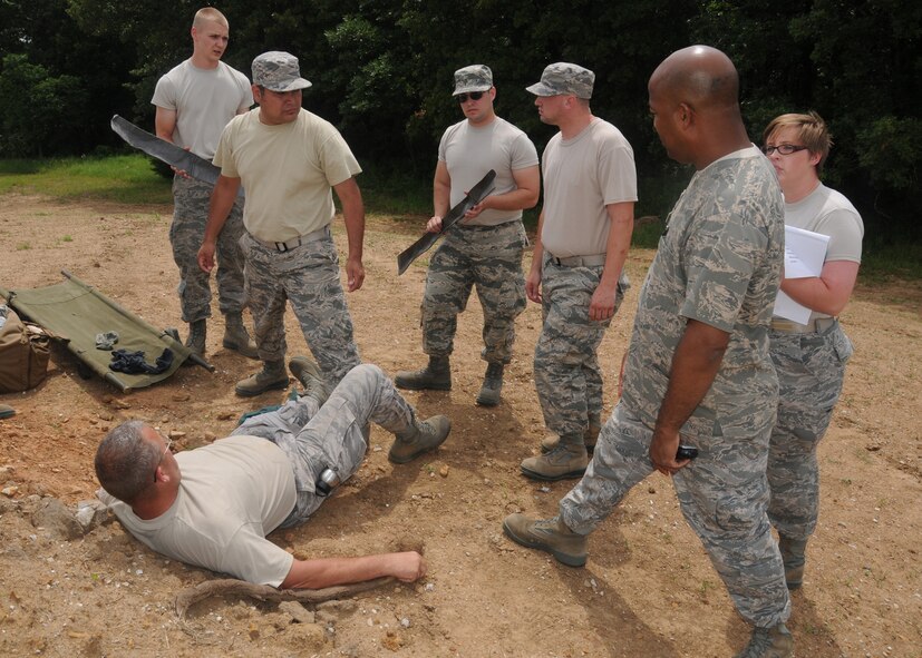 Members of the 131st Maintenance Group received valuable state emergency duty training during a concurrent June 16-22, 2014, AT week of training at Camp Clark, Nevada, Missouri.  Members pictured here receive field instruction on proper self aid buddy care techniques from 131st Bomb Wing Med Group personnel.  (U.S. Air National Guard photo by Senior Airman Nathan Dampf)