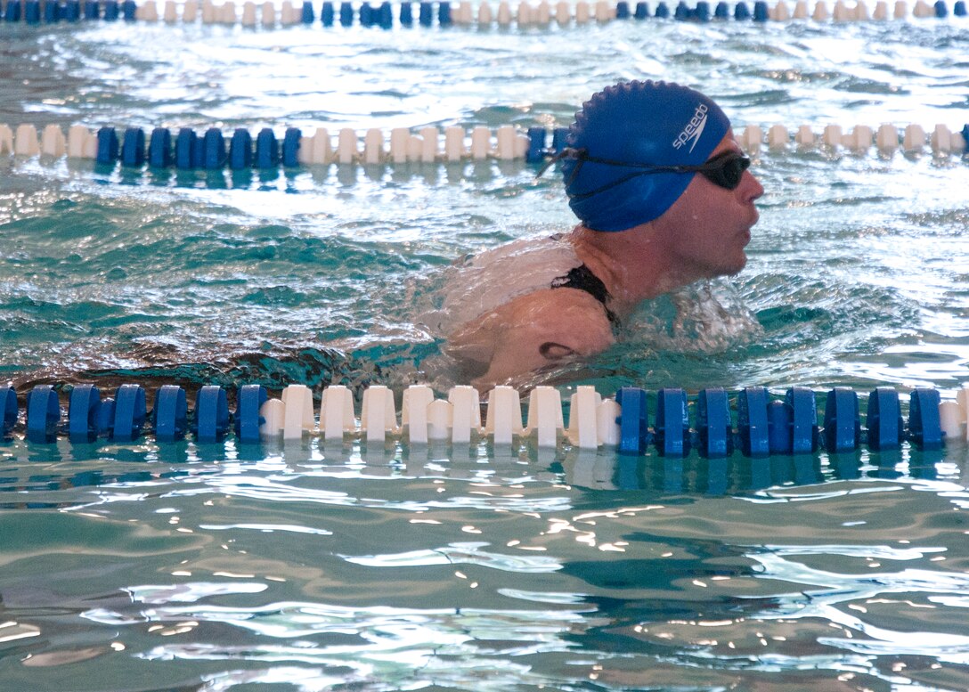 Staff Sgt. David Rasmussen, 37th Helicopter Squadron, competes in the swimming portion of F.E. Warren Air Force Base’s annual triathlon in the Aquatic Center, June 21. (U.S. Air Force photo by Airman Malcolm Mayfield)