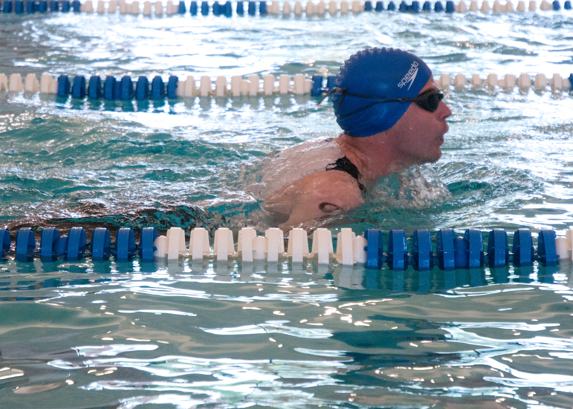 Staff Sgt. David Rasmussen, 37th Helicopter Squadron, competes in the swimming portion of F.E. Warren Air Force Base’s annual triathlon in the Aquatic Center, June 21. (U.S. Air Force photo by Airman Malcolm Mayfield)