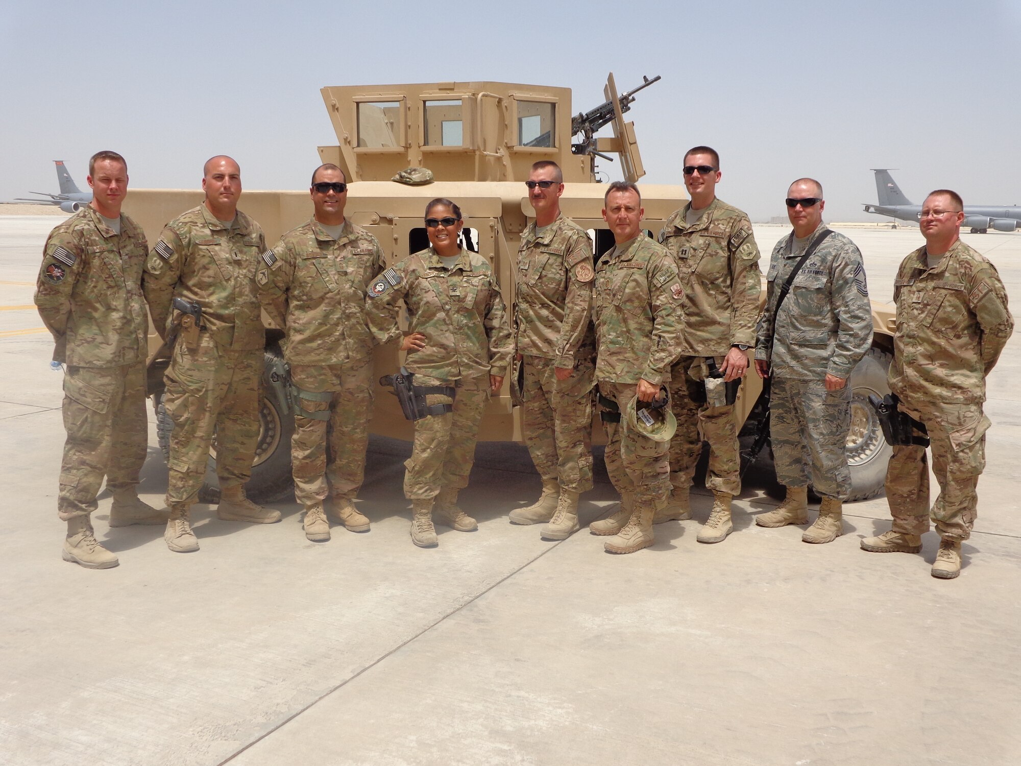 Chief Master Sgt. Carroll Holcombe, 4th Civil Engineer Squadron superintendent, poses in a group photo during a recent deployment serving with the 376th Expeditionary Mission Support Group at Transit Center at Manas, Kyrgyzstan. Holcombe received the Bronze Star medal, June 23, 2014, at Seymour Johnson Air Force Base, North Carolina. (Courtesy photo)