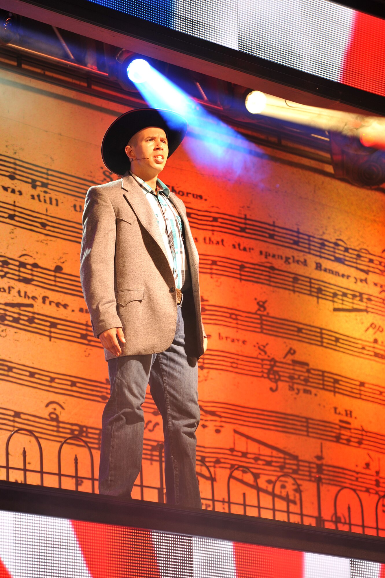 U.S. Army Staff Sgt. Duane Reno, an Army Soldier Show performer, sings during a tribute to 9/11 at the 2014 Army Soldier Show at Fort Eustis, Va., June 24, 2014.  Reno is a human resources specialist and hails from Salem, Ore.  (U.S. Air Force photo by Staff Sgt. Katie Gar Ward/Released)