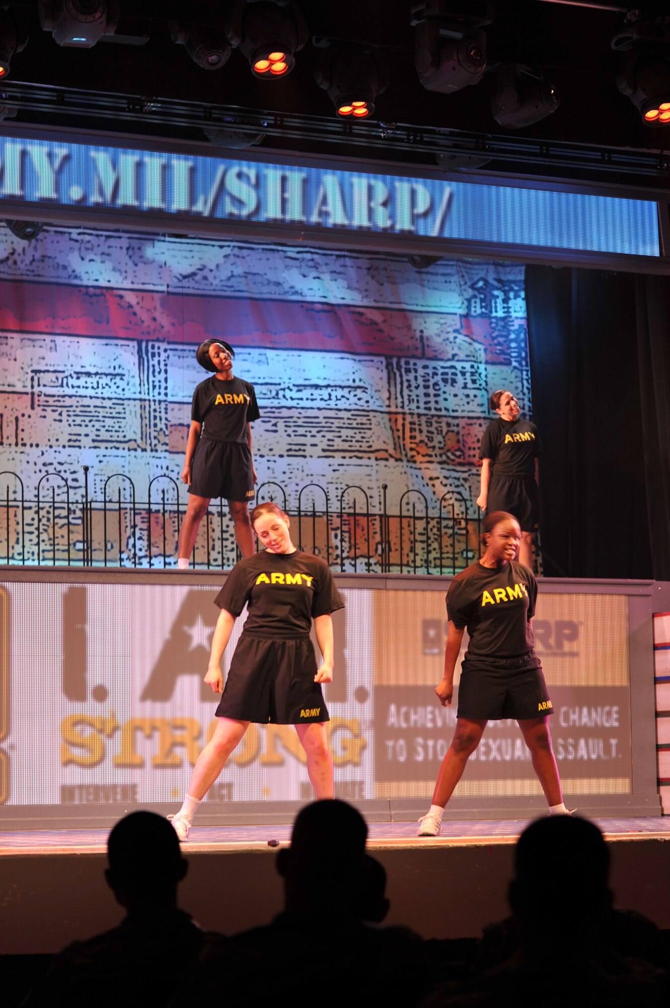Cast members of the 2014 U.S. Army Soldier Show perform during a Sexual Harassment/Assault Response and Prevention scene at Fort Eustis, Va., June 24, 2014.  The Soldier Show is the Army’s Broadway-style touring entertainment troupe, with shows highlighting various aspects of military culture. (U.S. Air Force photo by Staff Sgt. Katie Gar Ward/Released)