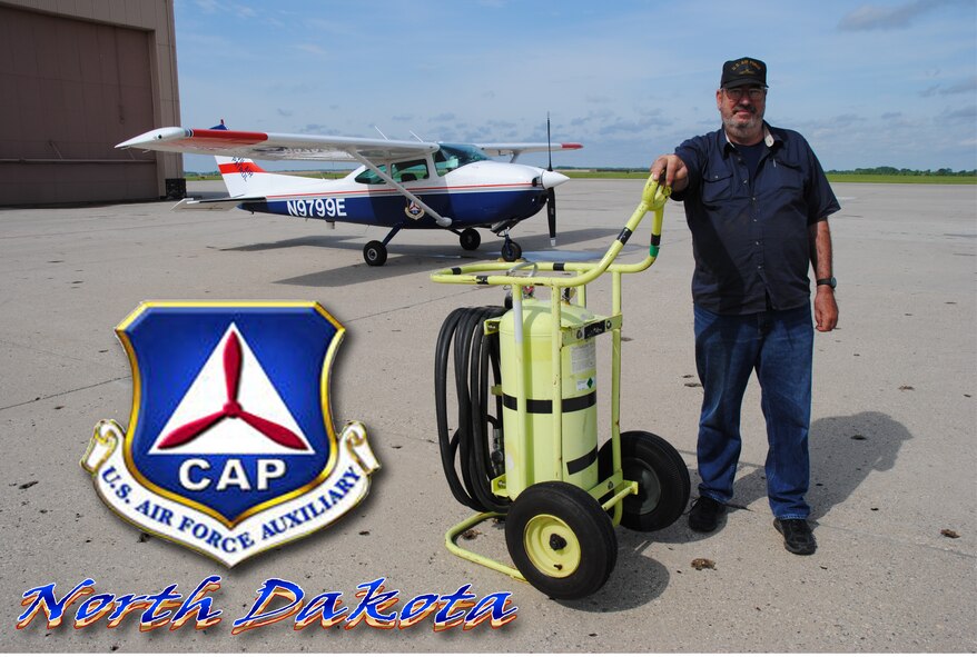 Retired Master Sgt. Al Vecchio, North Dakota CAP Wing deputy safety officer, poses for a photo in front of a Civil Air Patrol aircraft parked on the flightline of Grand Forks Air Force Base, N.D., on June 14, 2014.The CAP Airman made his way to Grand Forks AFB in order to take part in the 2014 M.A.C.A. Civil Fly-In. (U.S. Air Force photo illustration/Staff Sgt. Luis Loza Gutierrez)
