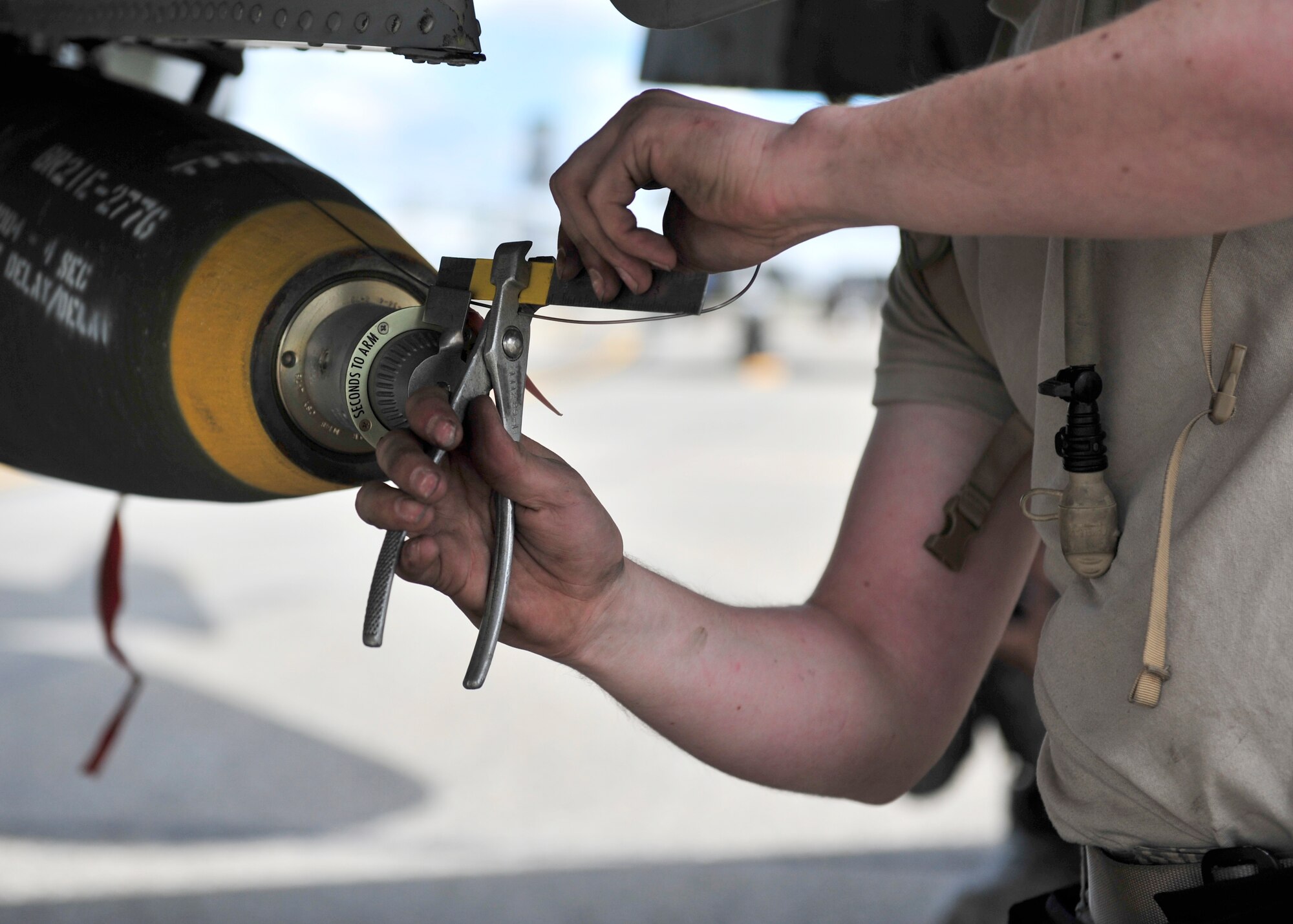 U.S. Air Force Airman 1st Class Jacob Fuller, 51st Aircraft Maintenance Squadron weapons loader assigned to Osan Air Base, South Korea, prepares a live MK82 AIR munition that will be used for training purposes during RED Flag-Alaska 14-2 June 20, 2014, Eielson Air Force Base, Alaska. RF-A gives participants the opportunity to sharpen their warfighting skills by training with U.S. and joint forces from around the globe in simulated combat scenarios. (U.S. Air Force photo by Senior Airman Ashley Nicole Taylor/Released)
