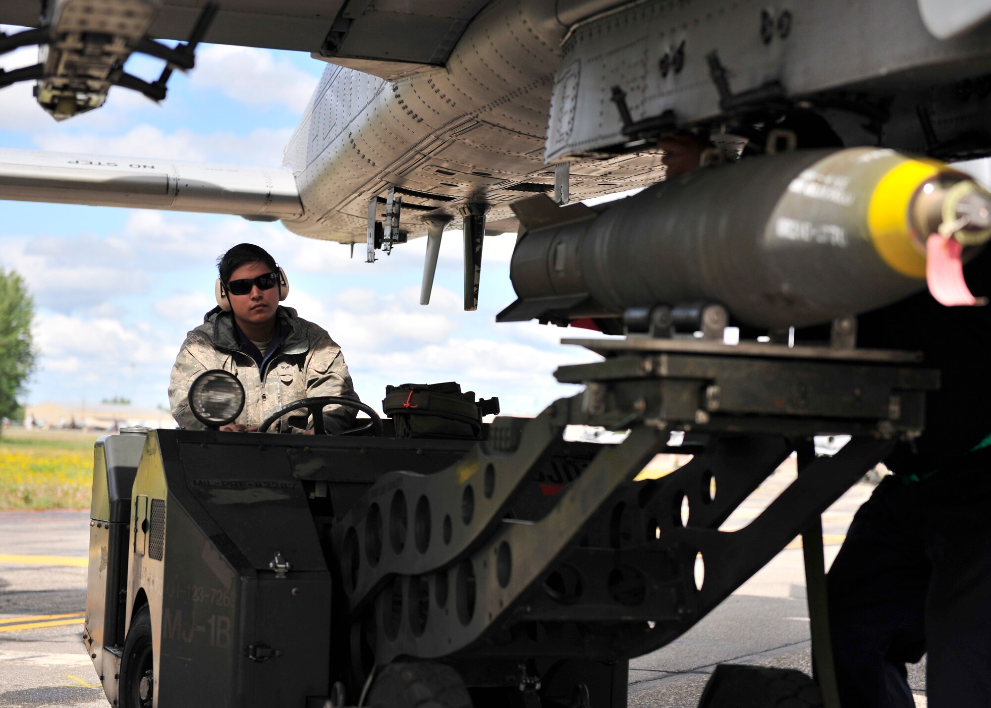U.S. Air Force Senior Airman William Howell, 51st Aircraft Maintenance Squadron aircraft armament weapons apprentice, loads a live MK82 AIR munition onto an A-10 Thunderbolt II during RED Flag-Alaska 14-2 June 20, 2014, Eielson Air Force Base, Alaska. A-10s are simple, effective and survivable twin-engine jet aircraft that can be used against all ground targets, including tanks and other armored vehicles. (U.S. Air Force photo by Senior Airman Ashley Nicole Taylor/Released)