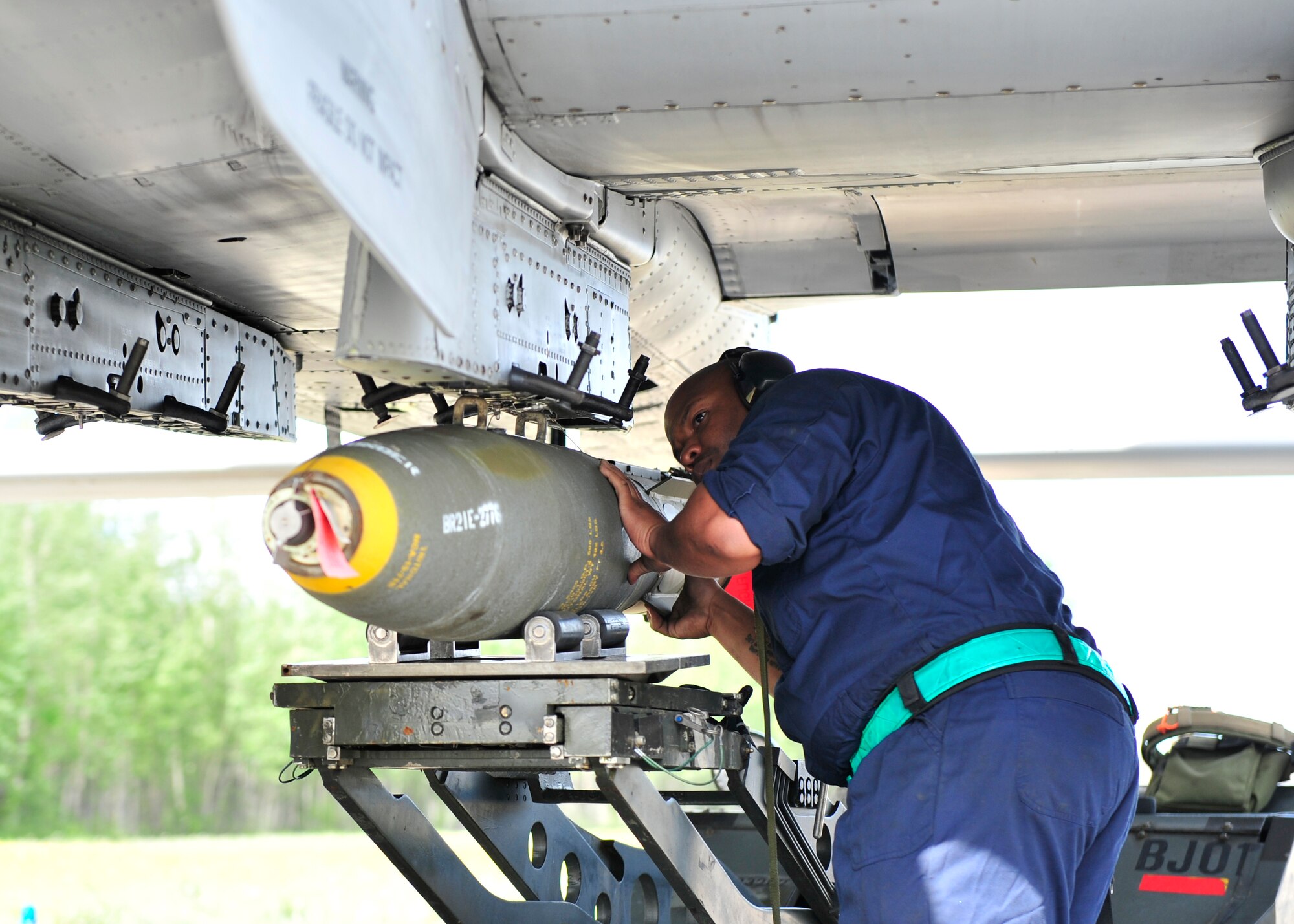 U.S. Air Force Staff Sgt.Kenneth Redmon, 51st Munitions Squadron load crew chief assigned to Osan Air Base, South Korea, loads a live MK82 AIR munition during RED Flag-Alaska 14-2 June 20, 2014, Eielson Air Force Base, Alaska. RF-A is a realistic, 10-day air combat training exercise held annually at Eielson and Joint Base Elmendorf-Richardson Air Force Base, Alaska. (U.S. Air Force photo by Senior Airman Ashley Nicole Taylor/Released)