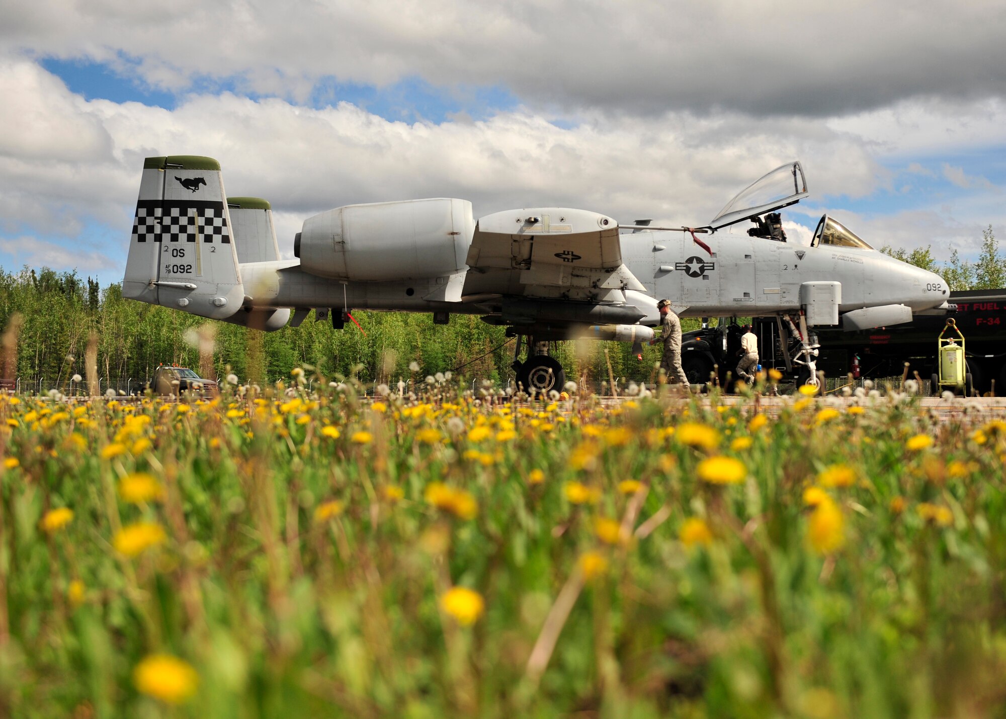 U.S. Air Force members from the 51st Aircraft Maintenance Squadron assigned to Osan Air Base, South Korea, perform preflight inspections on an A-10 Thunderbolt II during RED Flag-Alaska 14-2 June 20, 2014, Eielson Air Force Base, Alaska. RF-A is a multi-service, multi-national training exercise that enabled combat units to sharpen their skills in multiple scenarios over a two-week period. (U.S. Air Force photo by Senior Airman Ashley Nicole Taylor/Released)