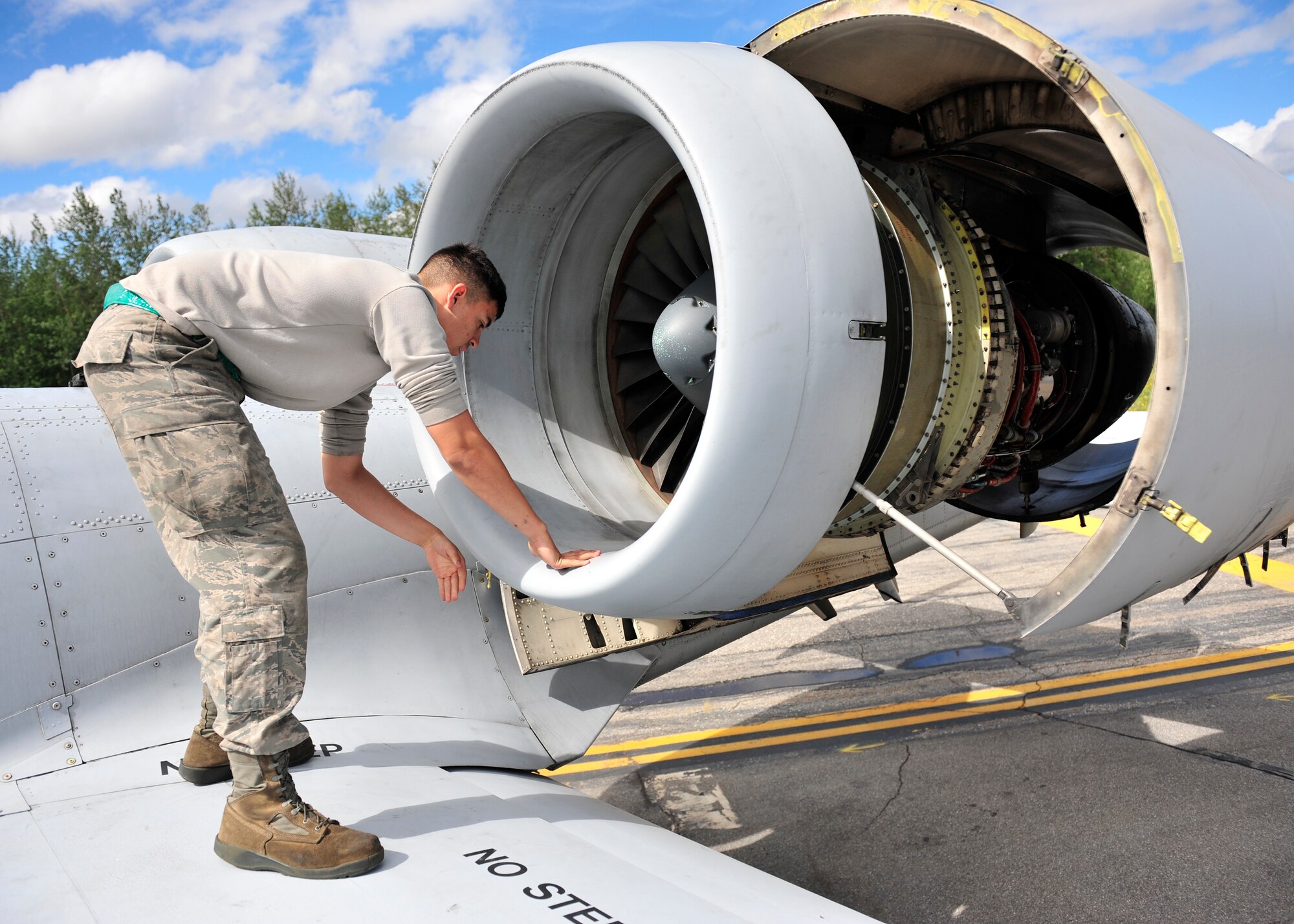U.S. Air Force Airman 1st Class Vincent Hale, 51st Aircraft Maintenance Squadron aircraft maintainer assigned to Osan Air Base, South Korea, checks for any cracks on an A-10 Thunderbolt II during RED Flag-Alaska 14-2 June 20, 2014, Eielson Air Force Base, Alaska. When units deploy to RF-A, maintainers must perform all aircraft maintenance, being as self-sufficient at Eielson as they would be in a wartime environment. (U.S. Air Force photo by Senior Airman Ashley Nicole Taylor/Released)