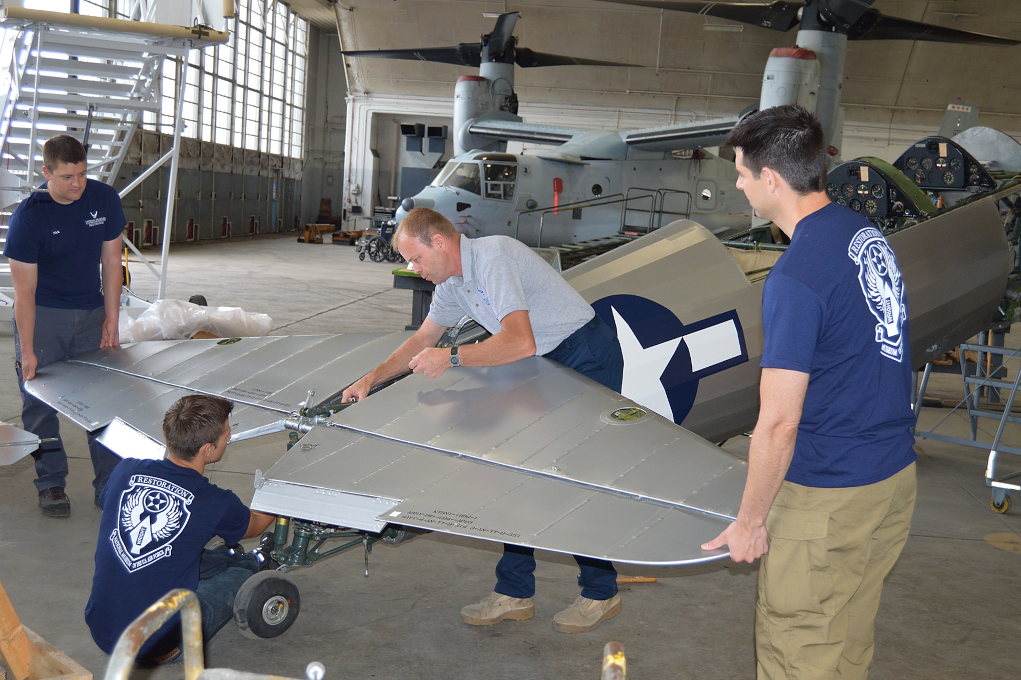 DAYTON, Ohio (06/2014) -- National Museum of the U.S. Air Force Restoration Specialists assemble the tail section of the Stearman PT-13D Kaydet. Plans call for the aircraft to be part of an expanded Tuskegee Airman exhibit in the World War II Gallery at the National Museum of the U.S. Air Force. (U.S. Air Force photo by Ken LaRock)