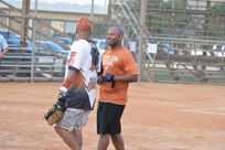 149th Fighter Wing Gunfighters first baseman Jason Session chats with teammate David Diaz after the team's 4-1 victory over the 543rd Support Squadron Spartans June 17 at Joint Base San Antonio-Lackland (Photo by Jose T. Garza III).
