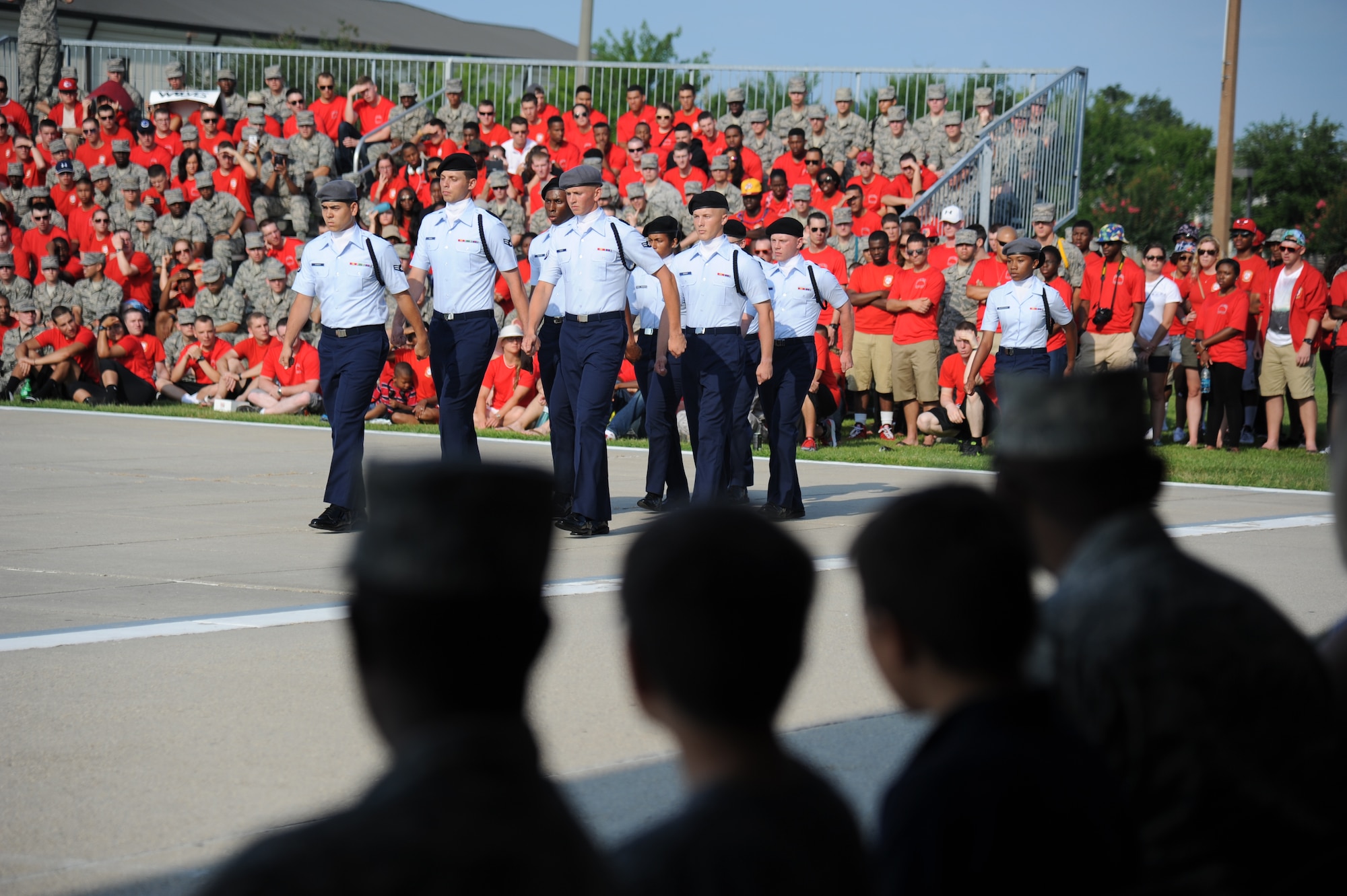 The 335th Training Squadron regulation drill team enters the field of regulation drill competition during the 81st Training Group drill down June 20, 2014, at the triangle, Keesler Air Force Base, Miss.  The 335th Bulls placed second in the regulation competition. (U.S. Air Force photo by Kemberly Groue)