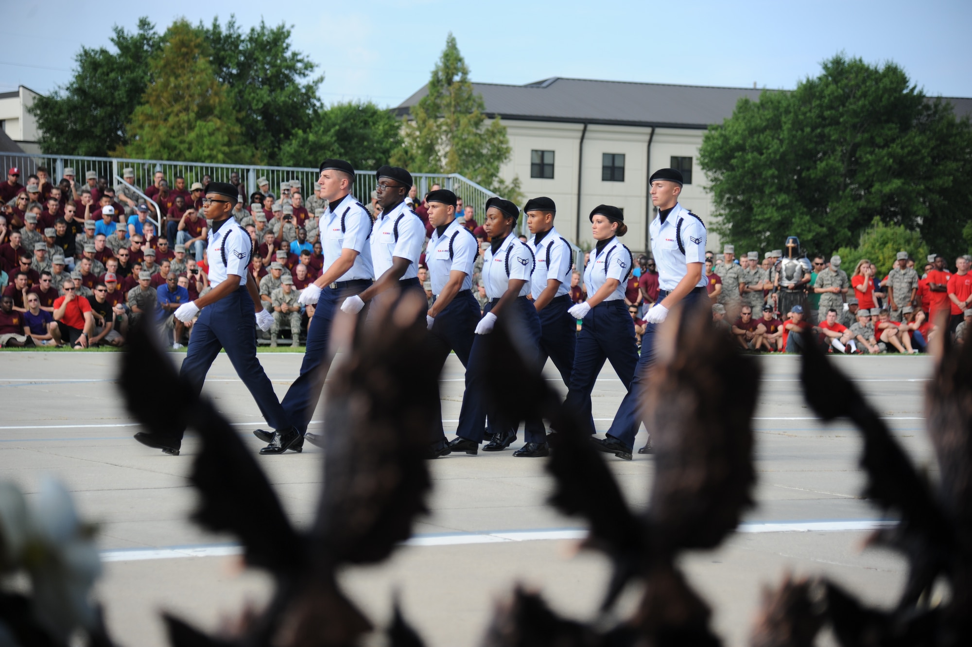 The 338th Training Squadron regulation drill team enters the field of regulation drill competition during the 81st Training Group drill down June 20, 2014, at the triangle, Keesler Air Force Base, Miss.  The 338th Dark Knights placed third in the regulation competition and second overall. (U.S. Air Force photo by Kemberly Groue)