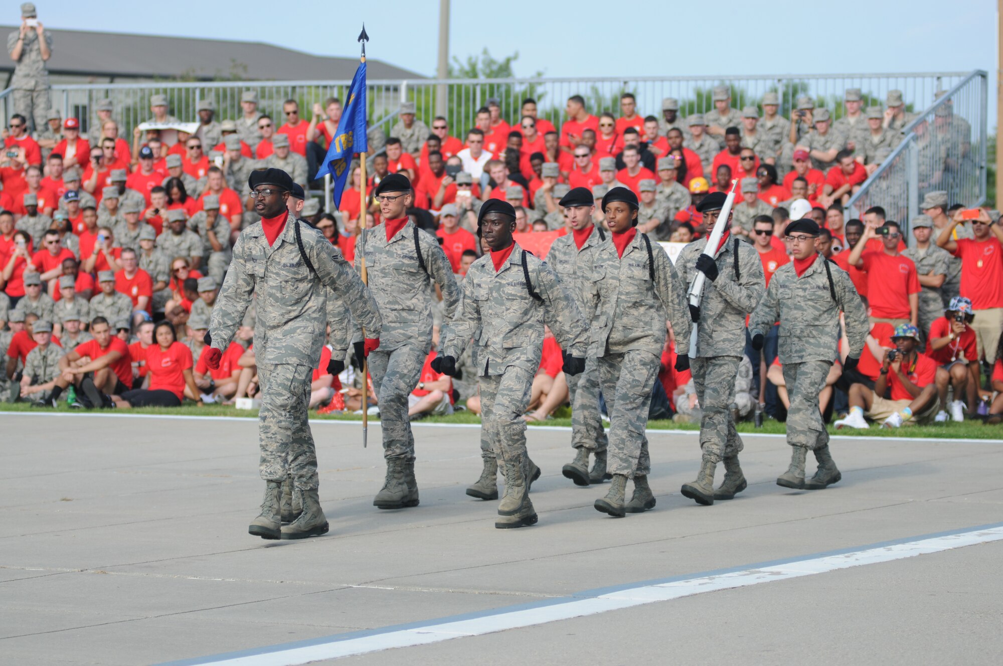 The 336th Training Squadron freestyle drill team enters the field of freestyle drill competition during the 81st Training Group drill down June 20, 2014, at the triangle, Keesler Air Force Base, Miss.  The 336th Red Wolves placed first in the regulation and freestyle competitions and was named as the overall winners.  (U.S. Air Force photo by Kemberly Groue)