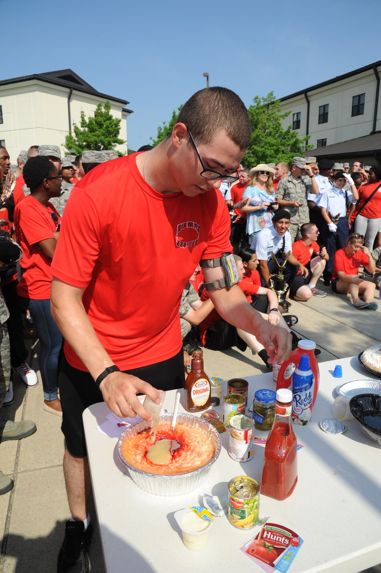 Airman 1st Class Joseph Craft, 336th Training Squadron, makes a “special” pie for a military training leader who will receive a pie-in-the-face during a squadron fundraiser June 20, 2014, at the Triangle, Keesler Air Force Base, Miss.  The squadron raised more than $1,500 to assist with the purchase of a walker for a local boy.  (U.S. Air Force photo by Kemberly Groue)