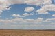 A U.S. Air Force C-130 Hercules with the 22nd Air Force Detachment 1 (Det 1), Air Force Reserve Command, airdrops a simulated load above Hubar drop zone at Fort Huachuca, Ariz., June 18, 2014.  Det 1 were participating in a two-week tactics courses hosted by the AATTC attached to the 139th Airlift Wing, Missouri Air National Guard.  (U.S. Air Force photo by Senior Airman Patrick P. Evenson/Released)