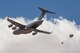 A Royal Australian Air Force C-17 Globemaster III with No. 36 Squadron (36 SQN) airdrops a simulated load above Hubar drop zone at Fort Huachuca, Ariz., June 18, 2014.  36 SQN were participating in a two-week tactics courses hosted by the AATTC attached to the 139th Airlift Wing, Missouri Air National Guard.  (U.S. Air Force photo by Senior Airman Patrick P. Evenson/Released)