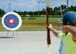 A child, who attended the Tyndall Youth Activities Center Olympic-style archery class, prepares to shoot at a target June 23. This class is designed to teach the fundamentals of archery such as appropriate stance, anchor points and releases. (U.S. Air Force photo by Airman 1st Class Dustin Mullen) 
