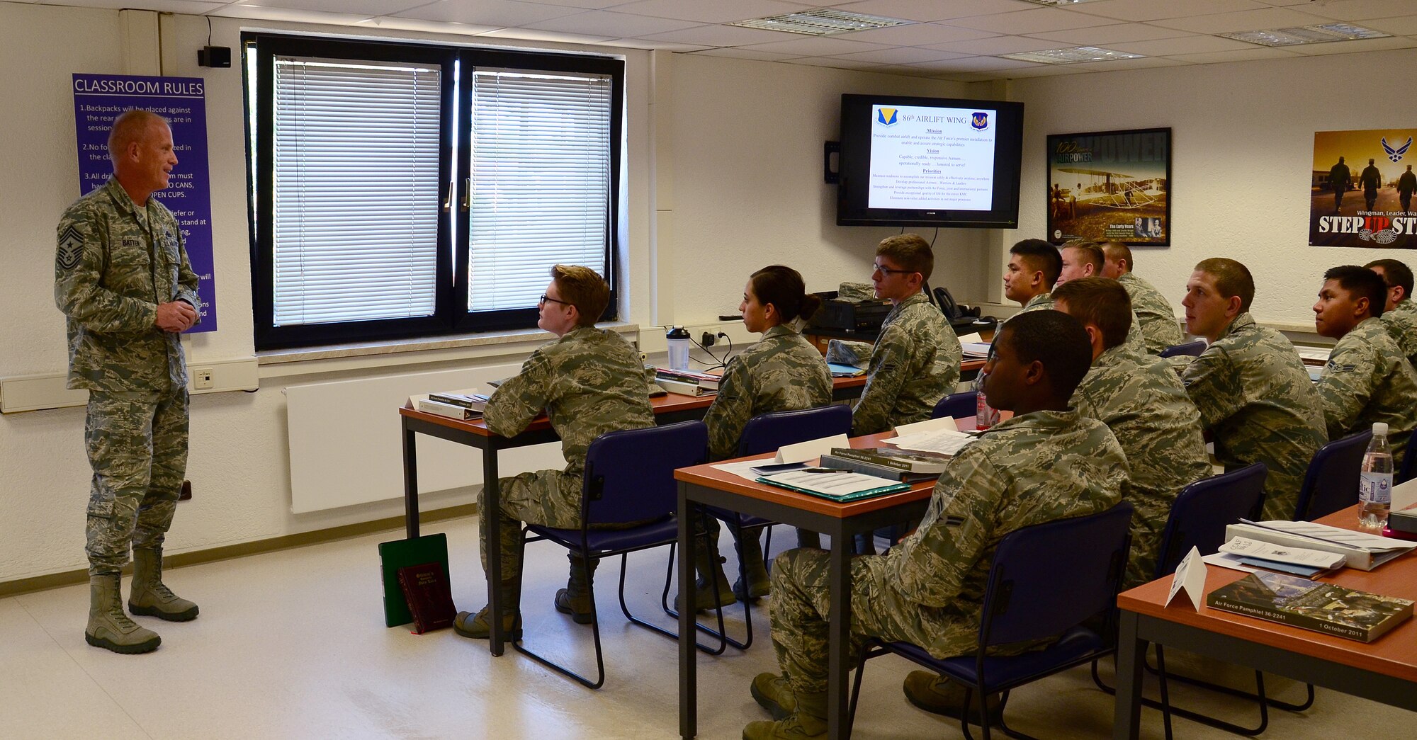 Chief Master Sgt. Frank H. Batten III, 86th Airlift Wing command chief, talks with Airmen at the First Term Airman Center, June 23, 2014, at Ramstein Air Base, Germany. As the wing's highest enlisted leader, Batten advises the commander and senior leaders on military readiness, mission effectiveness, professional development, morale, welfare, training and good order and discipline of the wing's personnel. He ensures the commander's policies and guidance are known, understood and enforced. (U.S. Air Force Photo/Senior Airman Timothy Moore/Released)