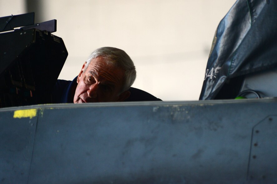 Former U.S. Air Force Capt. John Shinto looks into the cockpit of an F-16CJ Fighting Falcon at Shaw Air Force Base, S.C., June 16, 2014. Shinto served at Shaw for two years, 1967 and 1969, as a dentist during his military career before opening a private practice. (U.S. Air Force photo by Airman 1st Class Jensen Stidham/Released)