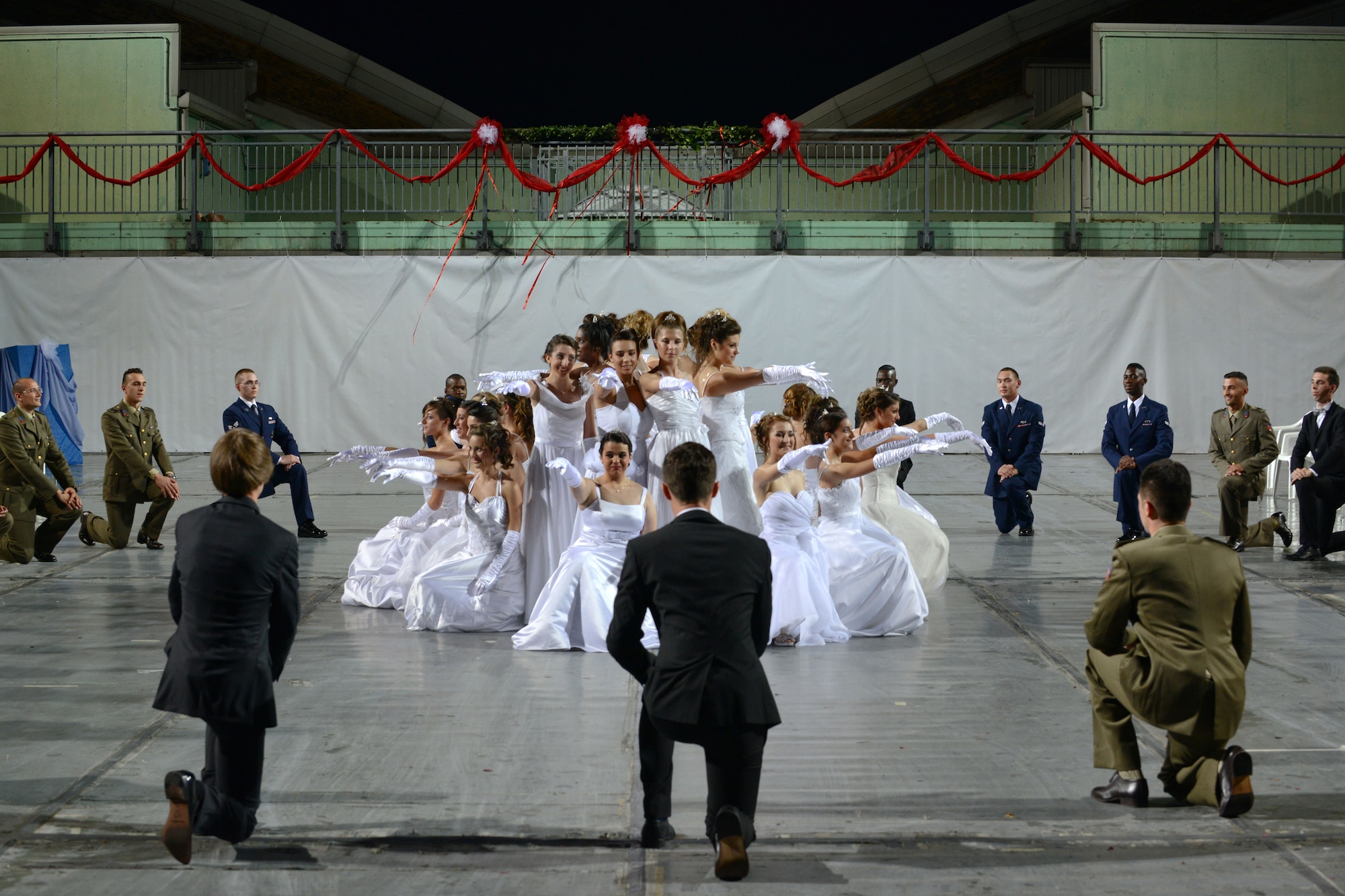 Participants of the 16th Annual Debutant Ball perform their dance routine in Cordenons, Italy, June 22, 2014. During the ball, 18-year-old Italian girls, or debutants, were introduced into society for having reached the age of adulthood. (U.S. Air Force photo/Airman 1st Class Ryan Conroy) 