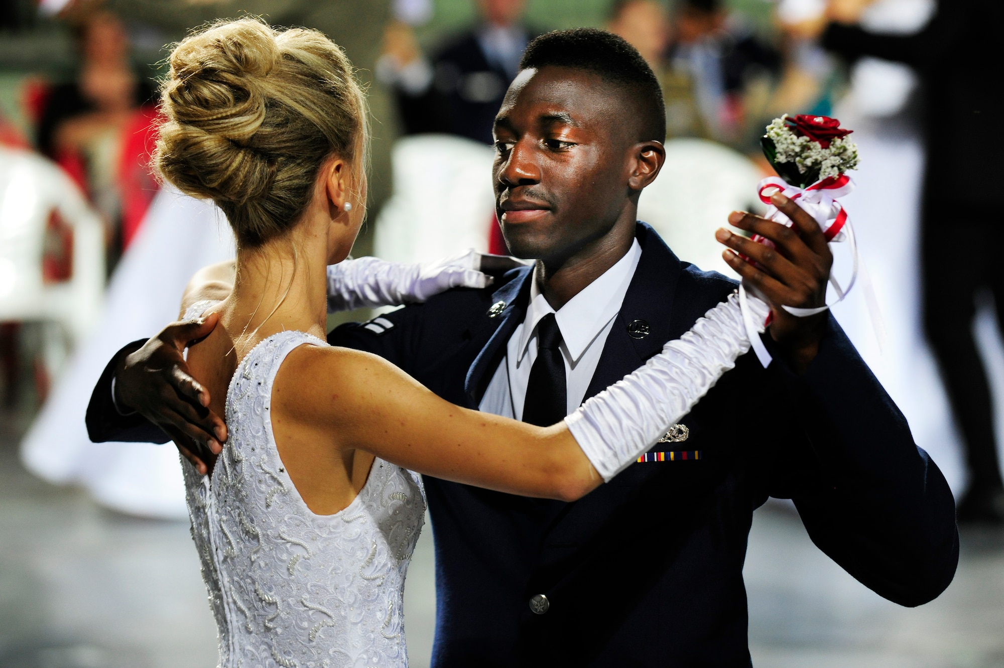 Airman 1st Class Jawanza Lynch, 31st Maintenance Squadron, performs the waltz with his partner, Cristina Marta, during the 16th Annual Debutant Ball in Cordenons, Italy, June 22, 2014. Airmen practiced for two to three hours, twice a week, for three months with their Italian partner leading up to the event. (U.S. Air Force photo/Airman 1st Class Ryan Conroy) 