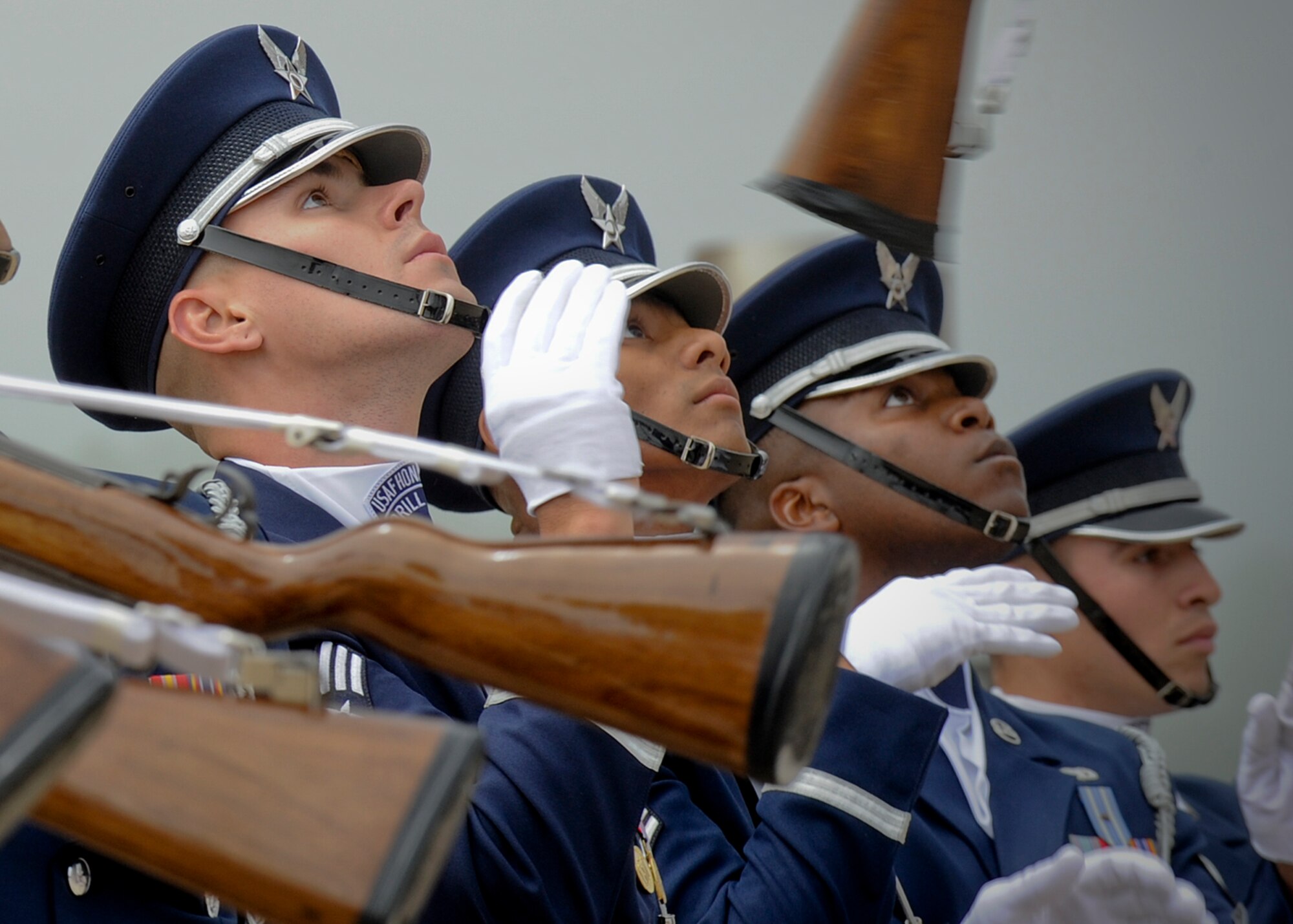 U.S. Air Force Drill Team members (left to right) Senior Airman Alan Schadd, Airman 1st Class Myron Lam, Staff Sgt. Antonio Lofton, and Senior Airman Sergio Maria execute a "double comeback" maneuver during the team’s appearance at the Milwaukee Air & Water Show June 22, 2014. The Drill Team is on a nine-day, seven-city, 10-performance tour across Wisconsin, Minnesota, South Dakota, Wyoming, and Nebraska. (U.S. Air Force Photo/1st Lt. Nathan Wallin)