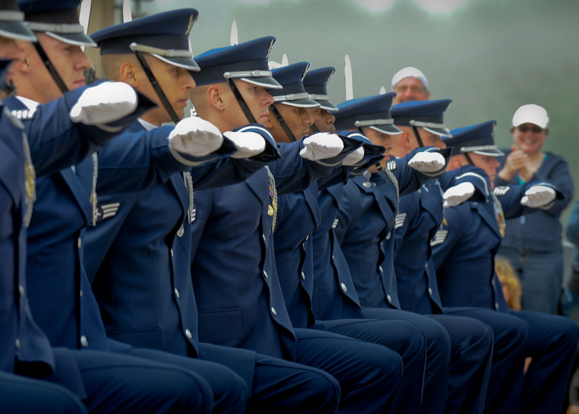 The U.S. Air Force Drill Team performs a line formation maneuver at the Milwaukee War Memorial during the Milwaukee Air & Water Show June 22, 2014. The Drill Team is on a nine-day, seven-city, 10-performance tour across Wisconsin, Minnesota, South Dakota, Wyoming, and Nebraska. (U.S. Air Force Photo/1st Lt. Nathan Wallin) 