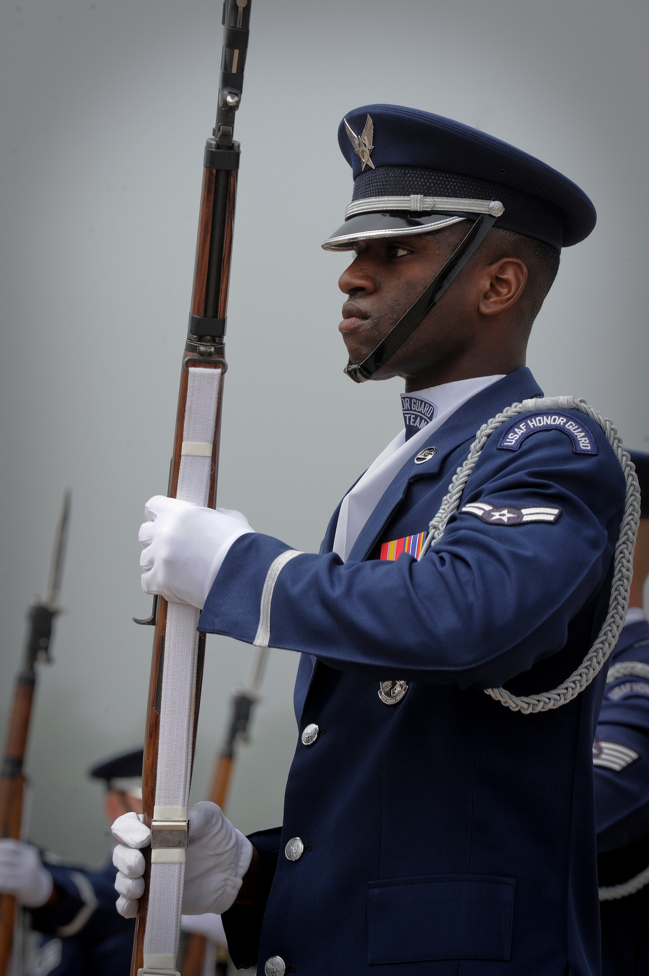 U.S. Air Force Drill Team member Airman 1st Class Omari Ferguson, 20, performs a maneuver at the Milwaukee Air & Water Show June 22, 2014. A native of Miami, Ferguson has been a member of the Drill Team since 2012. (U.S. Air Force Photo/1st Lt. Nathan Wallin) 