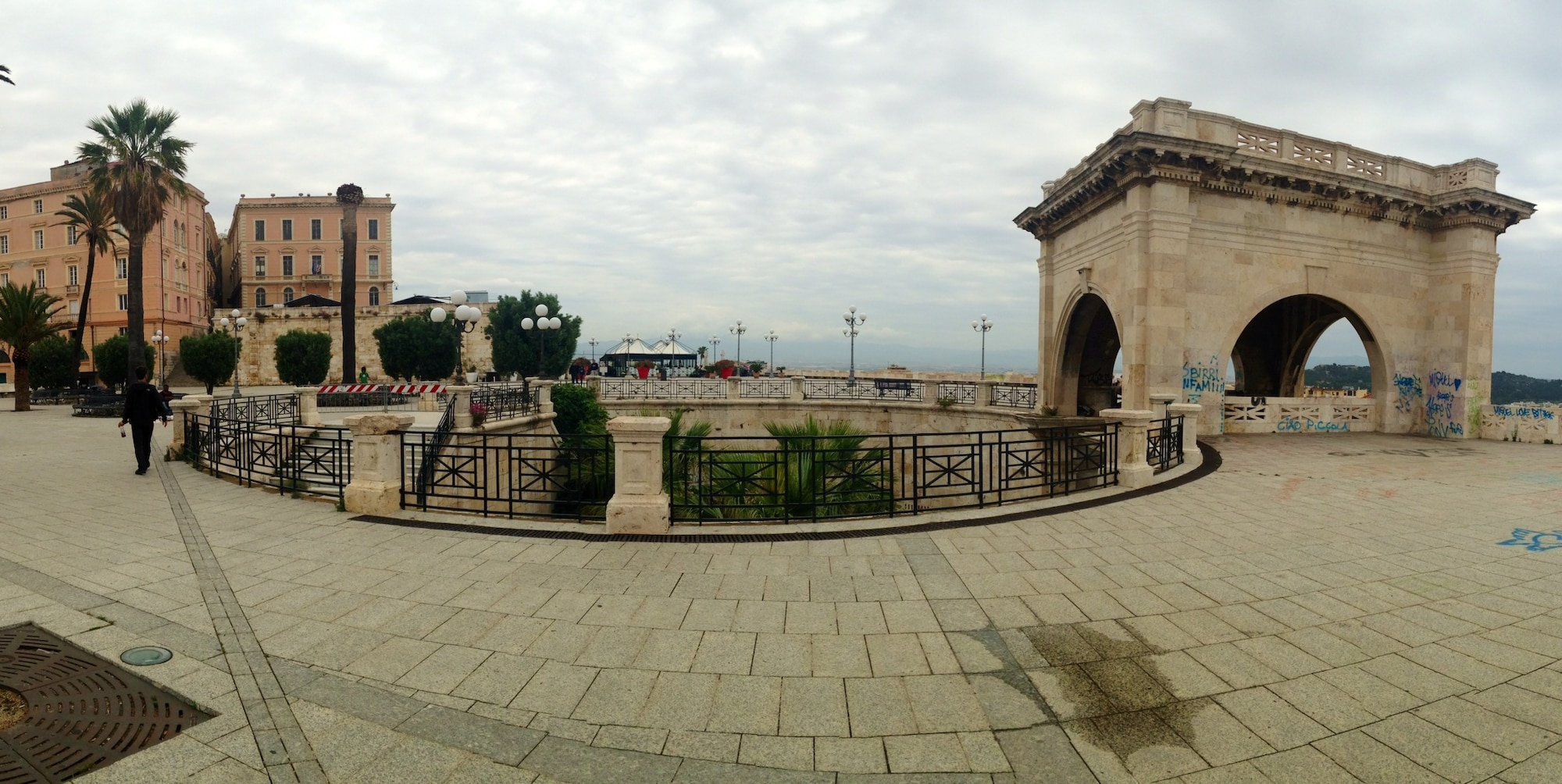 Tourists can see a panoramic view of the city by hiking to the top of Bastione Saint Remy—arguably the most notable landmark in the city. The wall has a double-staircase surrounded by a giant arch with a terrace and palm trees at the top. Many tourists can come to the wall on a clear day or during sunset, and venture steps away to the Marina quarter for dinner or aperitivo in the evening. 