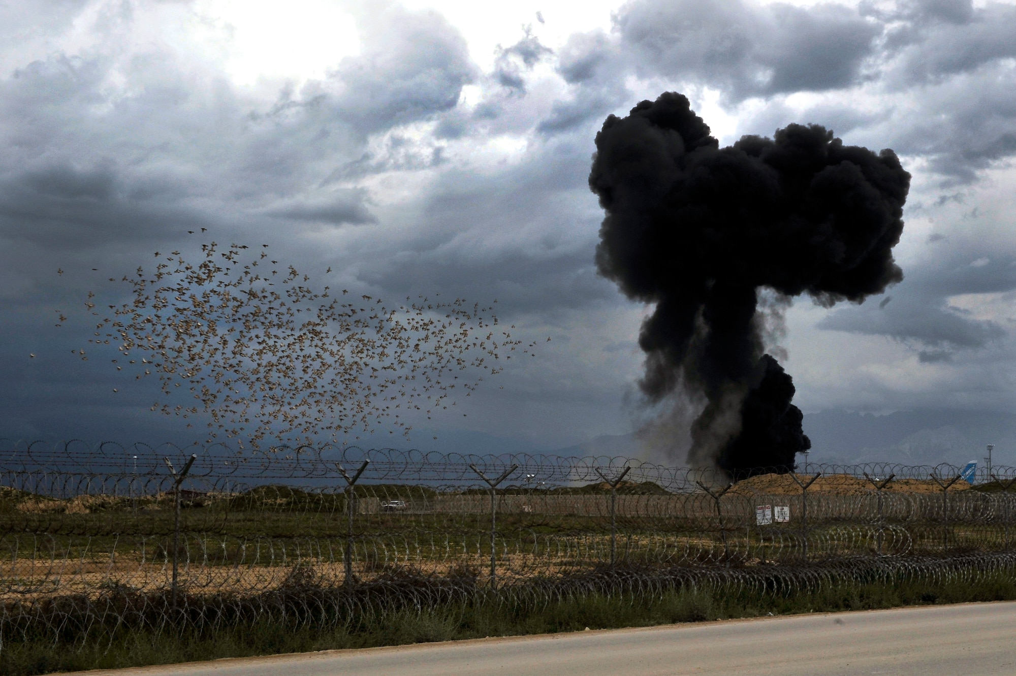 A National Air Cargo Boeing 747 airliner, with a seven-person crew and cargo consisting of five military vehicles, crashed shortly after takeoff from Bagram Airfield, Afghanistan, April 29, 2013. The aircraft erupted into flames near the end of the runway within the perimeter of the airfield, all seven crew members perished in the crash.  (U.S. Air Force photo/Senior Airman Chris Willis)