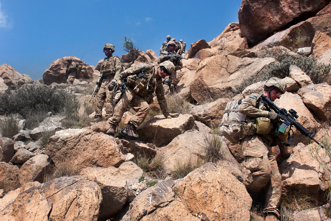 U.S. Army soldiers begin their descent from the summit of "Big Nasty," a mountain in Paktika province, Afghanistan, Sept. 8, 2011. The soldiers are assigned to Company C, 3rd Battalion, 66th Armor Regiment, 172nd Infantry Brigade. The unit was on a joint mission with the Afghan army and border patrol in the mountains near the Pakistan border. 
