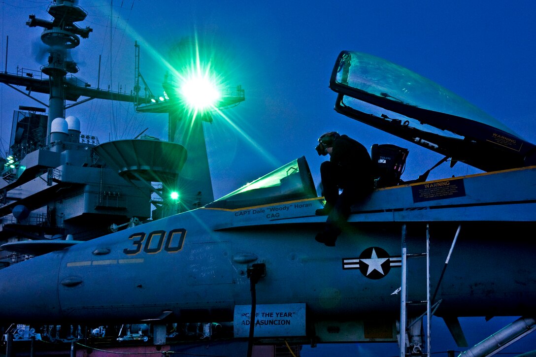 Navy Seaman Samantha Guay conducts maintenance on an F/A-18C Hornet aboard the Nimitz-class aircraft carrier USS John C. Stennis in the South China Sea, Sept. 2, 2011. Guay is a aviation structural mechanic airman. The John C. Stennis Carrier Strike Group is on a scheduled western Pacific Ocean and Arabian Gulf deployment. 