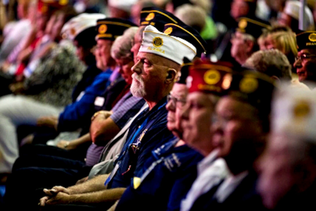 Veterans listen as President Barack Obama delivers remarks to the American Legion 93rd Annual Conference at the Minneapolis Convention Center in Minneapolis, Aug. 30, 2011. 