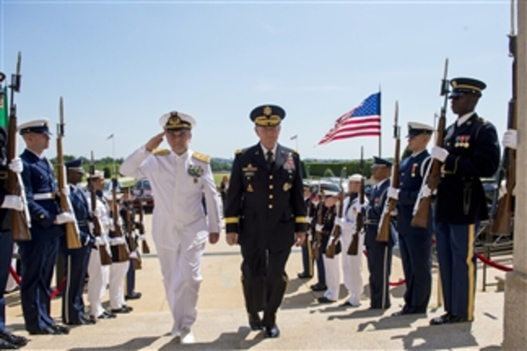 U.S. Army Gen. Martin E. Dempsey, chairman of the Joint Chiefs of Staff, hosts an honor cordon to welcome Italian Navy Adm. Luigi Binelli Mantelli, chief of Italy's defense staff, at the Pentagon, June 24, 2014. The two defense leaders met to discuss issues of mutual importance.