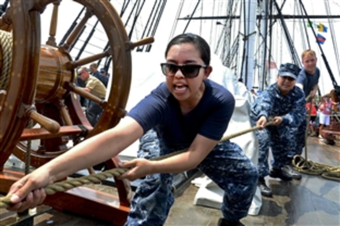 Navy Seaman Amada Williamson heaves on a line connected to the mizzenmast topsail aboard USS Constitution in Charlestown, Mass., June 17, 2014. Constitution sailors train during spring and summer months to learn seamanship techniques used aboard Old Ironsides since the 1790s.