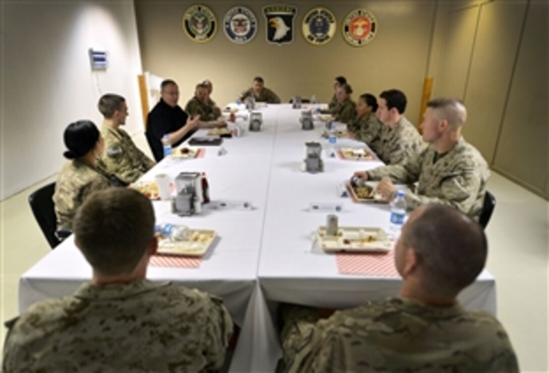 U.S. Deputy Defense Secretary Bob Work shares lunch with a group of junior officers on Bagram Airfield, Afghanistan, June 24, 2014. In his first foreign trip since taking office, Work visited U.S. service members, and met with Afghan and U.S. officials.