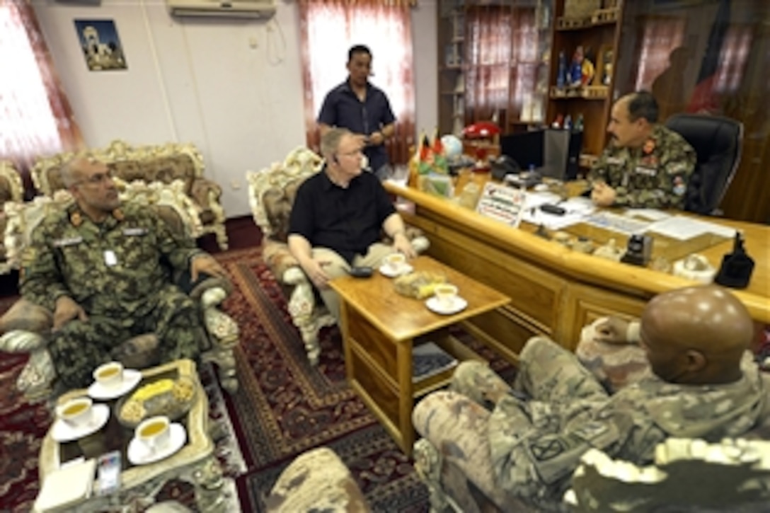 U.S. Deputy Defense Secretary Bob Work, center, meets with Afghan Army Maj. Gen. Mohammad Zaman Waziri, commander of the Afghan army's 201st Corps, on Forward Operating Base Gamberi, Afghanistan, June 24, 2014.