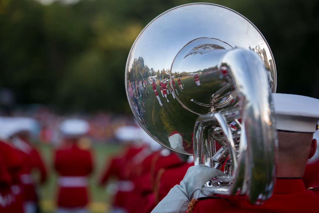 The United States Drum & Bugle Corps performs during a Tuesday Sunset Parade at the Marine Corps War Memorial in Arlington, Va., June 24. (Official Marine Corps photo by Cpl. Larry Babilya/Released)