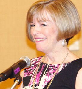 Deanie Dempsey, wife of Chairman of the Joint Chiefs of Staff Army Gen. Martin E. Dempsey, urges a group of military spouses to share their "extraordinary" stories with the American public while speaking at Military.com's 2012 Military Spouse Summit in Arlington, Va., March 3, 2012.